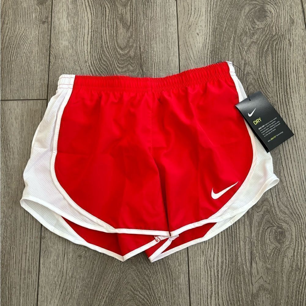Nike gold running shorts with underwear lining